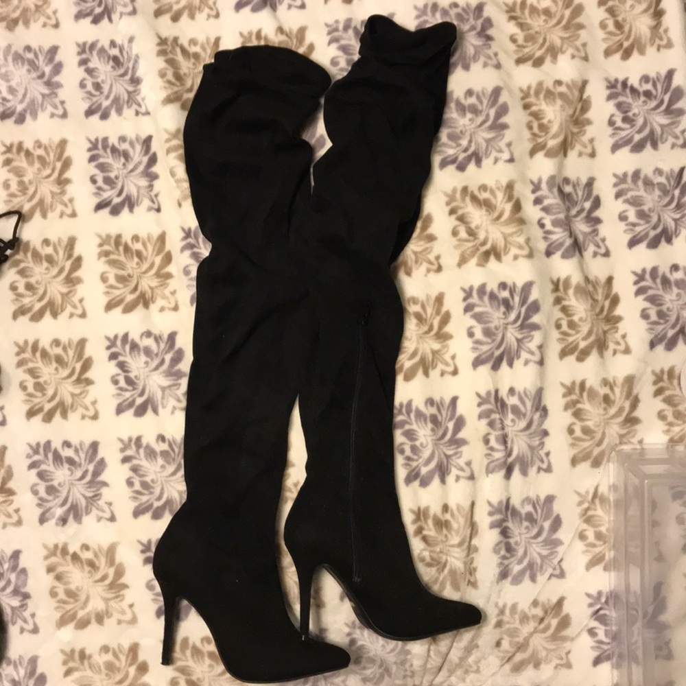 slouchy thigh-high boots. Never worn.